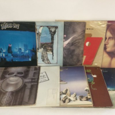 Two bags containing 20 prog rock LPs by various artists including Genesis, ELP, Yes and solo releases.