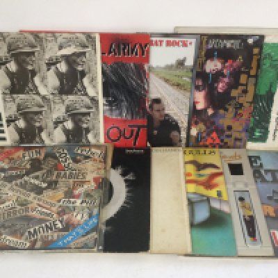 Two bags containing 22 punk and post punk LPs and 12" singles by various artists including Sex Pistols, Siouxsie & The Banshees, The Smiths and others.