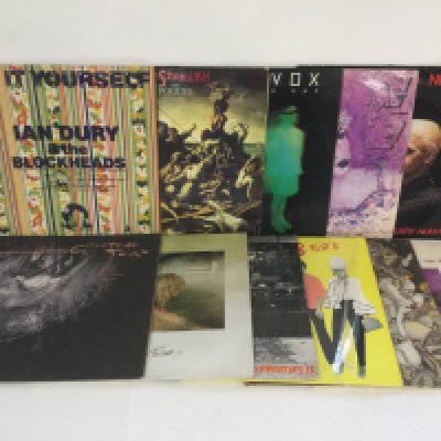 Two bags containing 22 post punk and new wave LPs LPs and 12" singles by various artists including The Pogues, Ian Dury, Cocteau Twins and others.