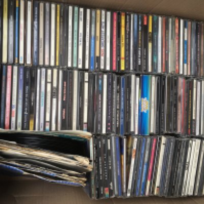 A box of CDs and 7" singles and two boxes of audio cassettes by various artists (3).
