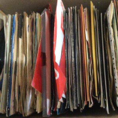 A box of 7" singles by various artists from the 1960s onwards.
