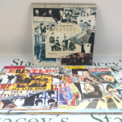 The Beatles Anthology volumes 1-3 triple vinyl LPs.