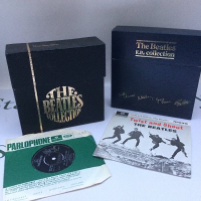 A Beatles boxed EP collection on vinyl plus a Beatles boxed 7" singles collection sadly incomplete, missing Love Me Do and All You Need Is Love is an earlier pressing (2).