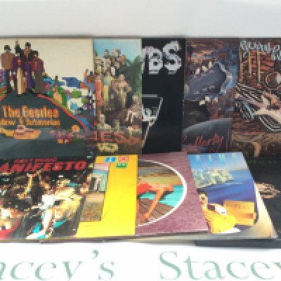 A collection of 25 LPs and 12" singles by various artists including The Beatles, Roxy Music, 10CC and more.