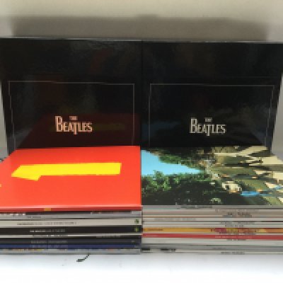 A complete Beatles DeAgostini 180g LP collection with inserts, a USB power bank and a boxed Beatles zippo lighter.