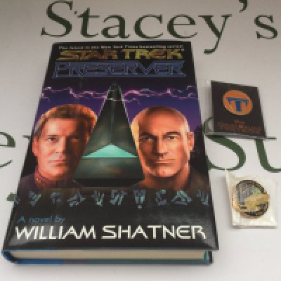 A William Shatner signed Star Trek hardback novel 'Preserver' plus two metal badges.