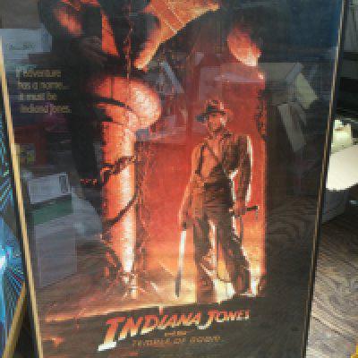 Four reproduction film posters including Indiana Jones And The Temple Of Doom, Attack Of The 50ft Woman and others plus a Jamiroquai poster (5).
