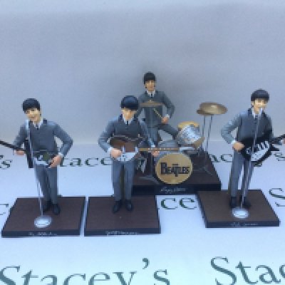 A complete set of Beatles figurines by Hamilton Gifts, with original tags.