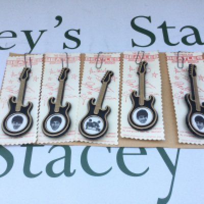 A full set of 1964 Beatles guitar shaped brooches by Invicta Plastics Ltd.