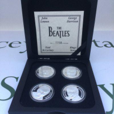 A cased limited edition set of four silver 1oz coins of The Beatles.