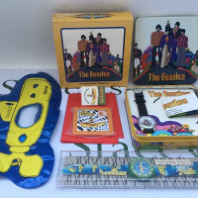 A cased Beatles Swatch watch and a cased Yellow Submarine fossil watch (2).