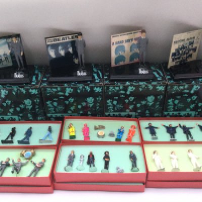 Six boxed sets of Beatles lead figures, four 'US albums' figurines and a set of the band playing live.