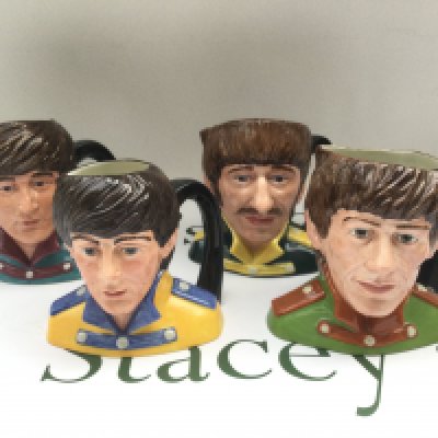 A set of four Royal Doulton Beatles character jugs, approx height 13cm.
