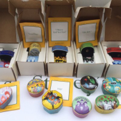 Twelve Franklin Mint The Best Of The Beatles ceramic music boxes.