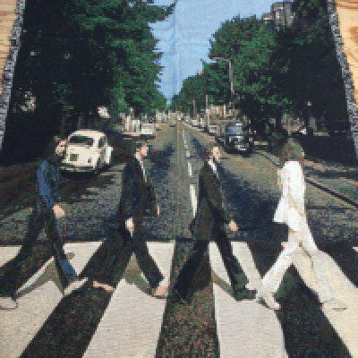 A limited edition Danbury Mint throw of The Beatles Abbey Road cover plus one other decorated with musical notation.