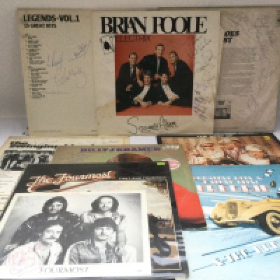 A collection of signed LPs by various artists including Billy J Kramer, Brian Poole & The Tremoloes, Freddie & The Dreamers and others.