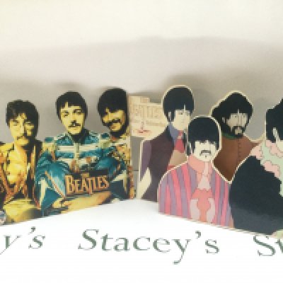 Two Beatles advertising shop counter displays, approx height 30cm.