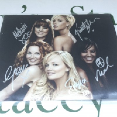 A fully signed Spice Girls publicity photo, approx 25cm x 20cm.