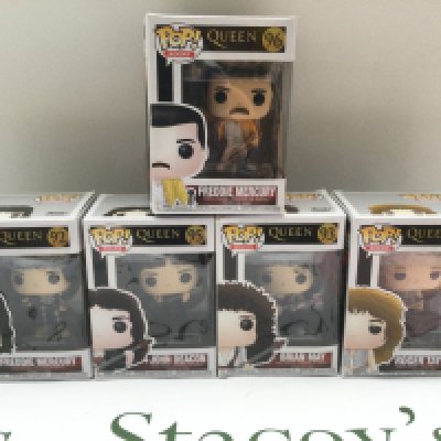 Five boxed Queen Funko Pop figures.