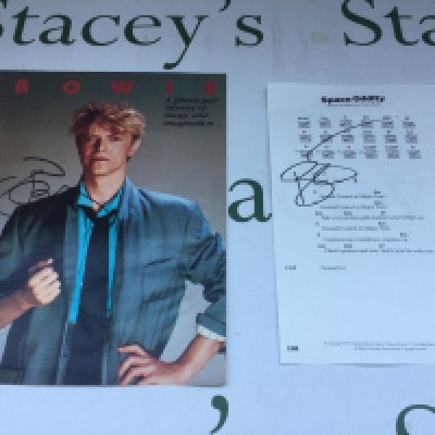 A David Bowie signed page of Space Oddity guitar tablature and lyrics plus a signed magazine page (2).