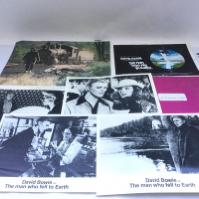 A collection of David Bowie movie ephemera comprising 'The Man Who Fell To Earth' promotional items, a signed promotional picture, 'The Hunger' script, 'Absolute Beginners' script and film stills.