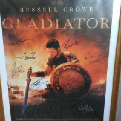 A multi signed Gladiator film poster signed by Russell Crowe, Ridley Scott, Richard Harris, Derek Jacobi and others, framed and glazed, no folds.