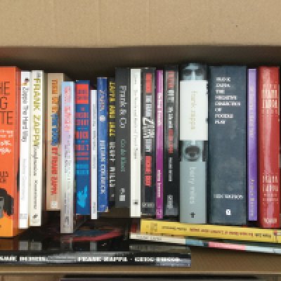 A box of Frank Zappa books.