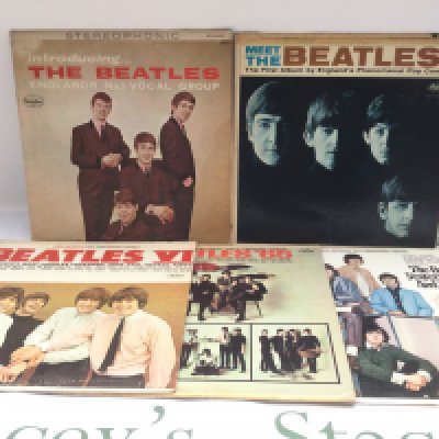 Ten Beatles LPs and a 12" singles comprising US and UK pressings.
