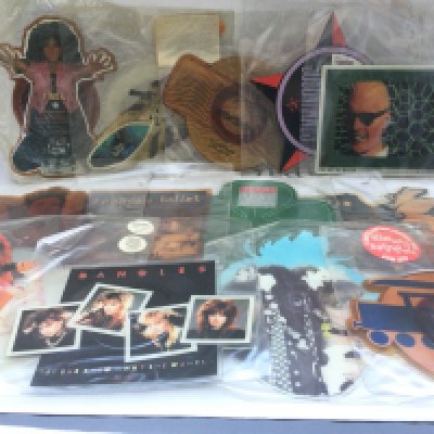 A box of picture discs, coloured vinyl and shaped discs comprising 12" and 7" singles by various artists including T Rex, OMD, Madonna, Kiss and many more.