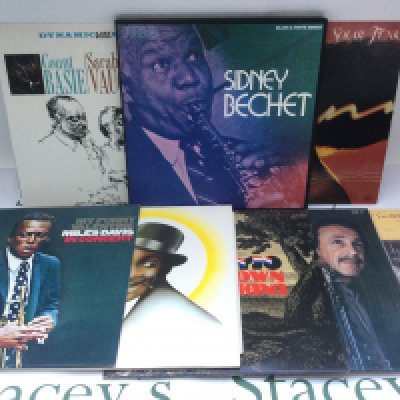 A box of mainly jazz LPs snd 78s by various artists including Miles Davis, Sidney Bechet, Fats Waller and others..