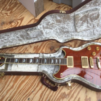 A Westone Prestige 250 electric guitar with hard carry case.