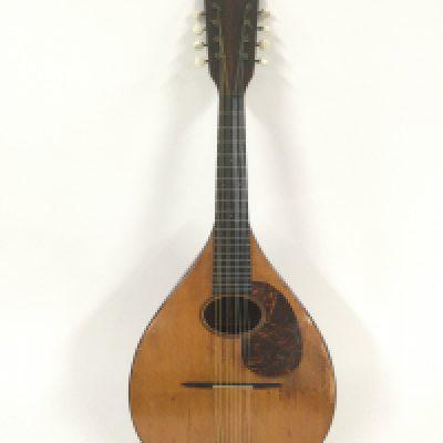 A 1923 CF Martin & Co mandolin. Comes supplied with original case and a new example.