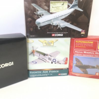 4 Boxed Corgi Aircraft. Including a Spitfire. A Mustang. A Boeing Stratocaster. Etc.