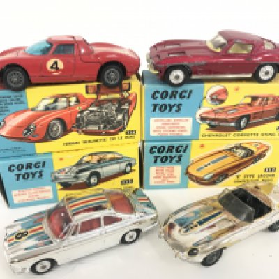 4 X Boxed Corgi Vehicles. A Ferrari #314. A Chevrolet Corvette Sting Ray #310 a Simca 1000 #315 and a E Type Jaguar #312.
