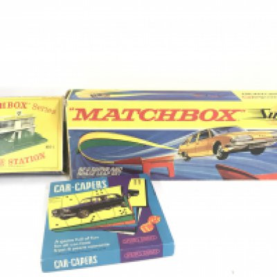 A Boxed Matchbox Service Station #MG-1. A Matchbox SF-3 Curve And Space Set. And a Spears Game Car-Capers Board Game.(3).