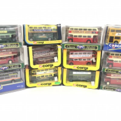A Collection of Boxed Corgi Buses.