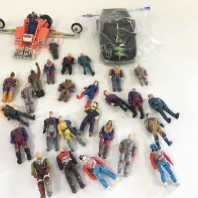A collection of vintage Mask figures and vehicles