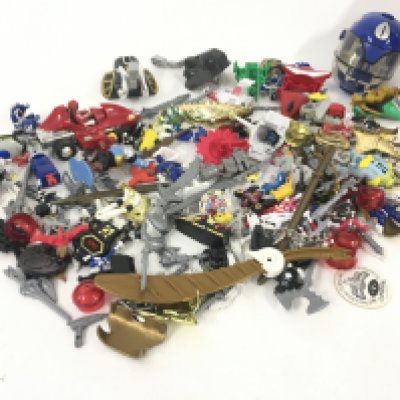 A collection of of Power Rangers parts and accessories.