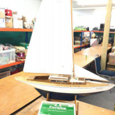 A remote controlled yacht with controller. Approximately 5ft height and 3ft length. No reserve.