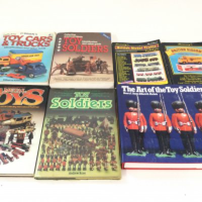 A box of reference books. Mainly toy soldiers.