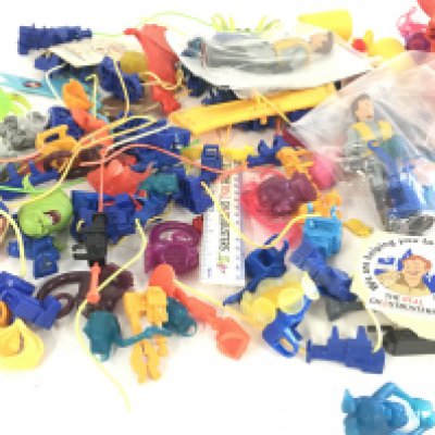 A collection of of Ghostbusters figures and accessories