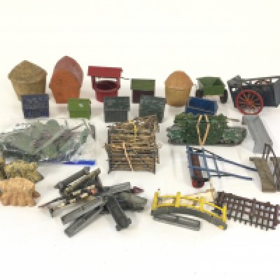 A box containing a quantity of Britains lead farm figures and Hagar. Plus other make pre war buildings.