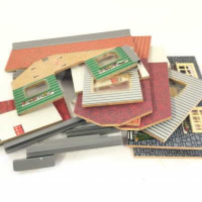 A box containing Britains and other Diecast animals. Figures and animals. Also a bag containing a dismantled farm building.