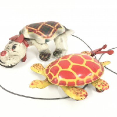 2 X Mobo tinplate Squeeze and Grip Toys.