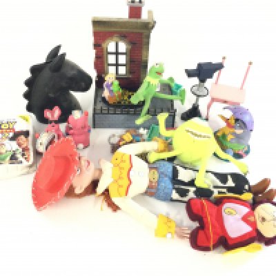 A box containing a quantity of mixed figures and small teddies mostly Disney.