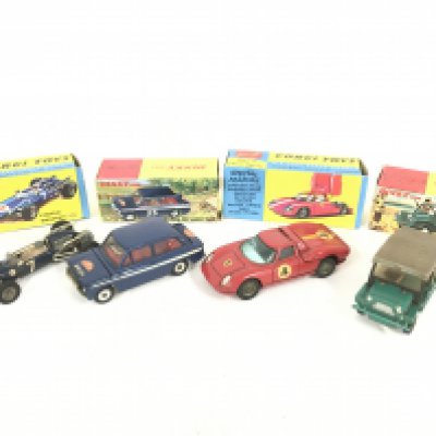 A Boxed Corgi Cooper Maserati F/1 #156. A boxed Corgi Ferrari Berlinetta #314. A Boxed dinky Hillman Imp #214 and a boxed Dinky Mini Moke #342.