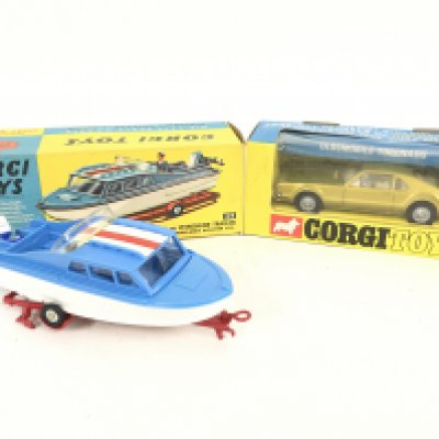 A Boxed Corgi Dolphin 20 Cruiser On Wincheon Trailer #104 and a Oldsmobile Toronado #276.