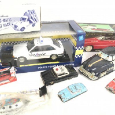 A Collection of Various TinPlate Vehicles and a Boxed model Icons Police Car 1:18 Scale.