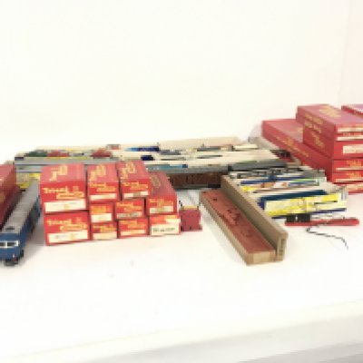A large collection of Triang 00 gauge model railway wagons and coaches..one locomotive..track and accessories.