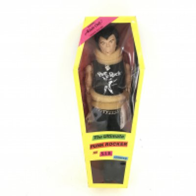 A Boxed Sid vicious Doll.